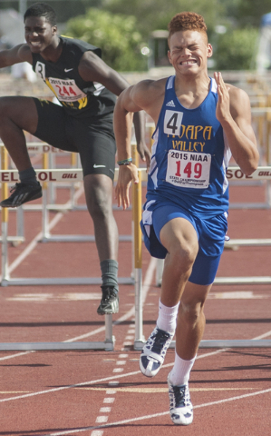 Moapa Valley’s R.J. Hubert finishes the D1-A 110-meter hurdles in first place during t ...