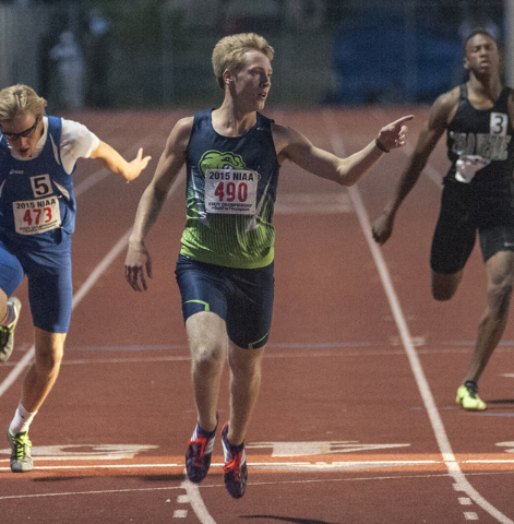 Green Valley High School’s Ian Mack celebrates as he finishes first in the D1 200-mete ...