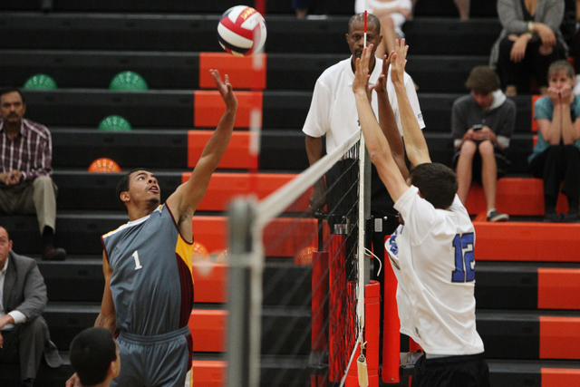 Del Sol’s Jey Pete (1) hits the ball to Sierra Vista’s Steven Thomas (12) in the ...