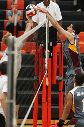 Del Sol’s Anthony Nehme (12) goes up for a block against Sierra Vista in their men&#82 ...