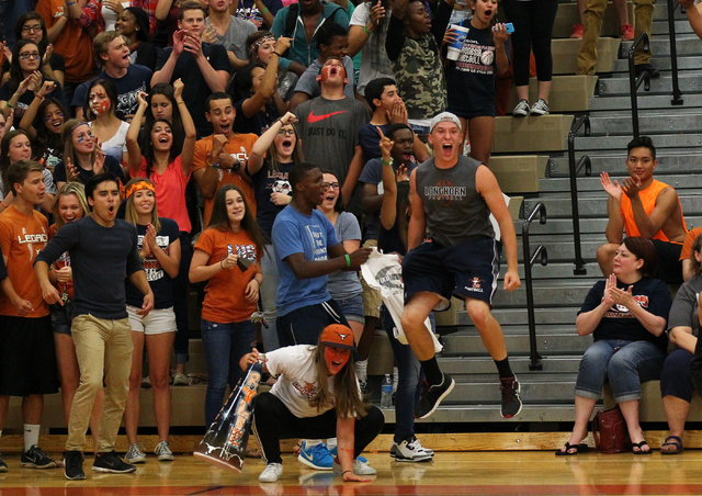 Legacy fans cheer as the team plays against Las Vegas during the Division I state volleyball ...