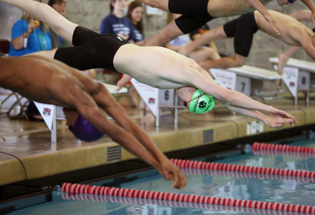 Palo Verde’s Logan Houck, right, starts the 500-yard freestyle during the Division I s ...