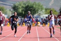 Desert Pines’ Artis McCoy, center, competes in the 1-A Boys 100 at the NIAA track and ...