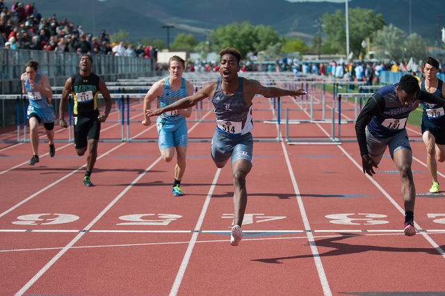 Liberty’s David Washington competes to win in 110 meter hurdles during the NIAA Divisi ...