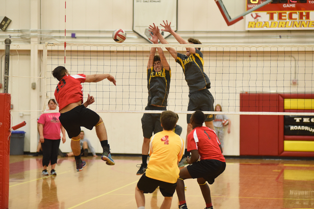 Tech’s Jesse Rojas (13) spikes the ball against Clark during their Division I-A state ...