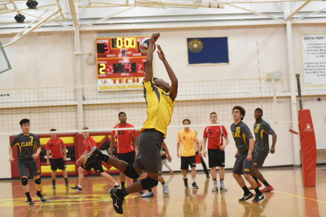 Clark’s Dane Taylor (19) digs the ball against Tech during their Division I-A state vo ...