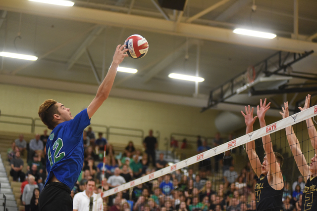 Green Valley’s Chase Larson (12) spikes the ball against Foothill during their Divisio ...