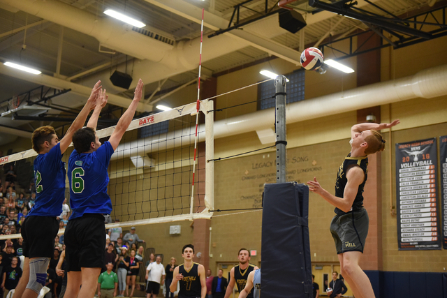 Foothill’s Mason Hanson (2) spikes the ball against Green Valley’s Zachary Hewit ...