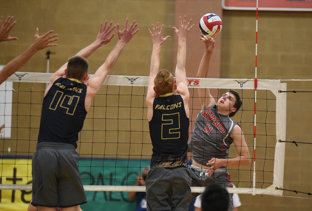 Arbor View’s Treven Clizbe (11) spikes the ball against Foothill’s Jonny Rolle ( ...