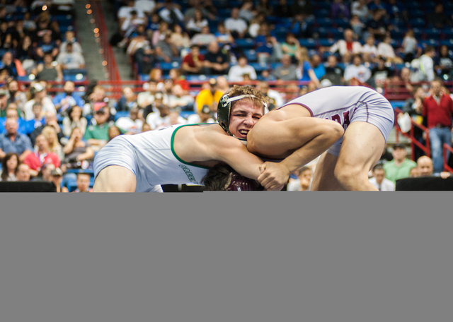 Green Valley High School’s Jared Brathor, left, wrestles Cimarron-Memorial’s Ang ...