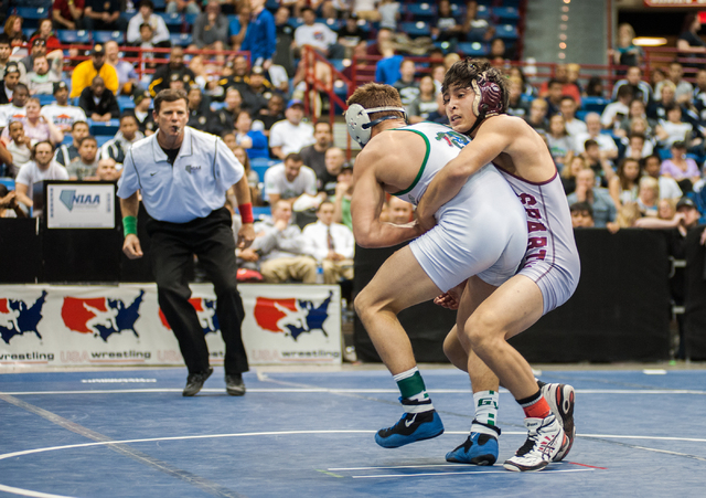 Green Valley High School’s Jared Brathor, left, wrestles Cimarron-Memorial’s Ang ...