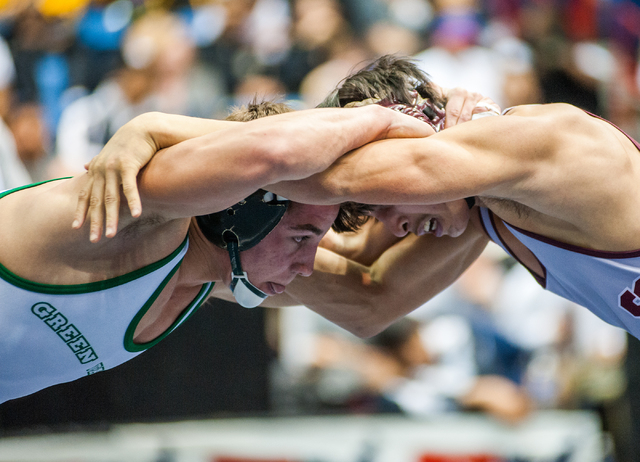 Green Valley High School’s Jared Brathor, left, wrestles Cimarron-Memorial’s Ang ...