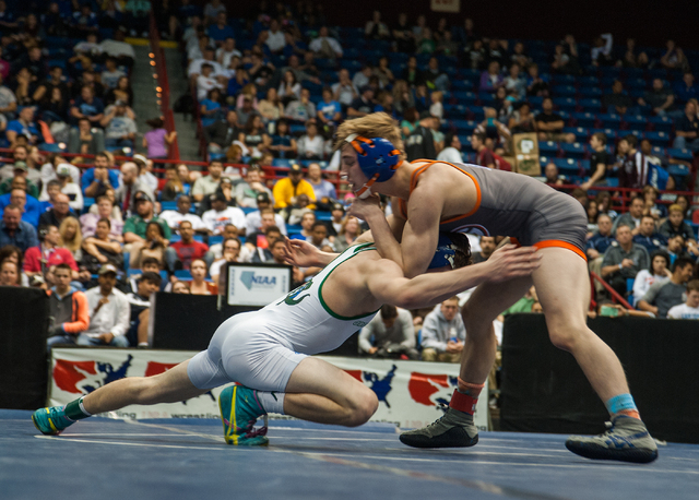 Green Valley High School’s Josh Temple, left, wrestles Bishop Gorman’s Mason Cam ...