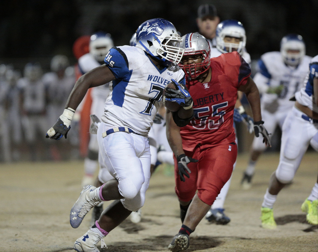 Liberty’s Josh Bernard-Lee (55) chases Basic’s Kendahl Blakely (7) during the Su ...