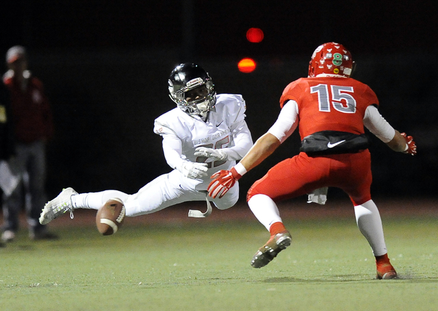 Bishop Gorman’s Tyjon Lindsey (25) narrowly misses a catch while being covered by Arbo ...