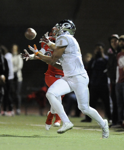 Bishop Gorman’s Alize Jones (8) catches a pass in front of Arbor View’s Herman G ...