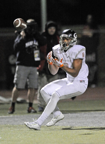 Bishop Gorman tight end Alize Jones (8) hauls in one of his three touchdown passes against A ...