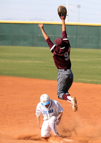 Cimarron-Memorial’s Tyler Giovinco goes up for a catch as Bishop Gorman’s Beau C ...