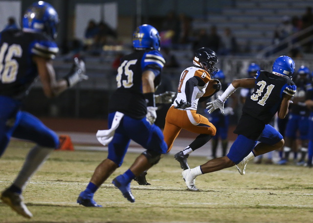 Legacy Marquell Evans (8) runs the ball against Sierra Vista during a Sunset Region quarterf ...