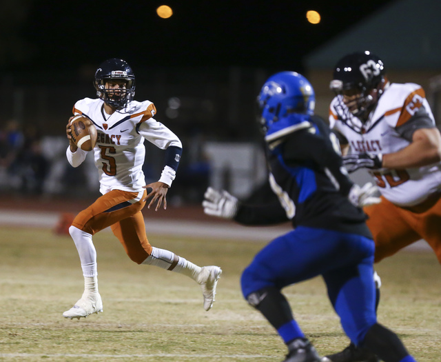 Legacy quarterback Roberto Valenzuela (5) looks for an open pass during a Sunset Region quar ...