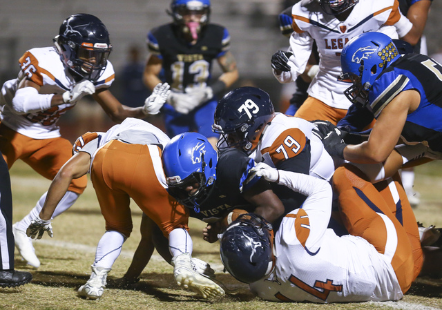 Sierra Vista’s Bryan LaGrange (28) is tackled by Legacy defense during a Sunset Region ...