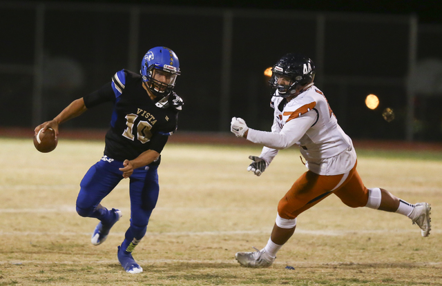 Sierra Vista quarterback Oscar Aliaga (10) looks for an open pass as Legacy’s Jalen Al ...