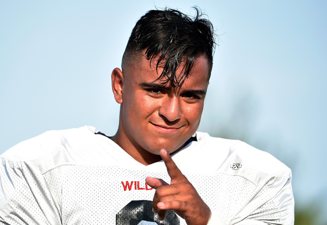 Las Vegas High linebacker Cruz Littlefield mugs for the camera before a scrimmage against Gr ...