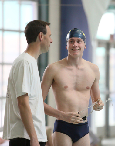 Faith Lutheran senior Bowen Becker, 17, right, and head coach Stephen Blank speak during the ...