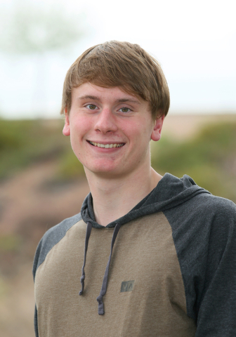 Faith Lutheran senior Bowen Becker, 17, stands outside Pavilion Center Pool Wednesday, March ...