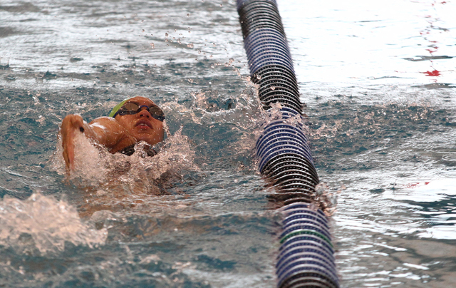 Rancho’s Tonicia Thomas swims backstroke in the practice lane before competing in the ...