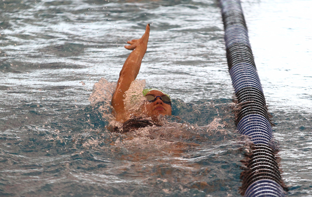 Rancho’s Tonicia Thomas swims backstroke in the practice lane before competing in the ...