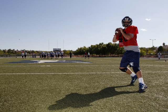 The Meadows quarterback Jake Gleason steps back for a pass during practice. Gleason passed f ...