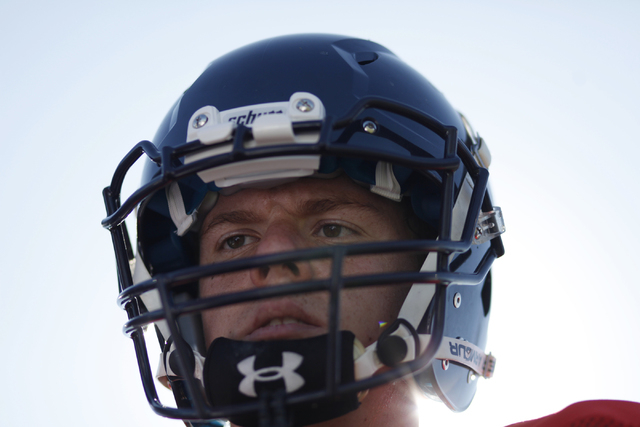 The Meadows quarterback Jake Gleason listens to his coach during practice. (Erik Verduzco/La ...