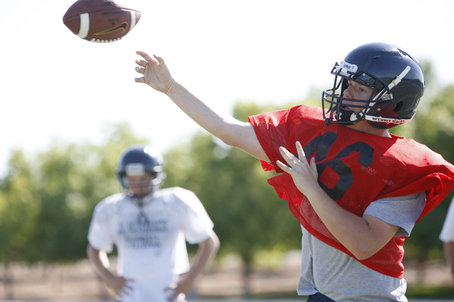 The Meadows quarterback Jake Gleason throws a pass during practice. Gleason passed for 1,138 ...