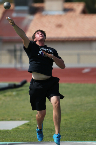 Brady Williams, 18, practices the shot put during a practice at Green Valley High School in ...