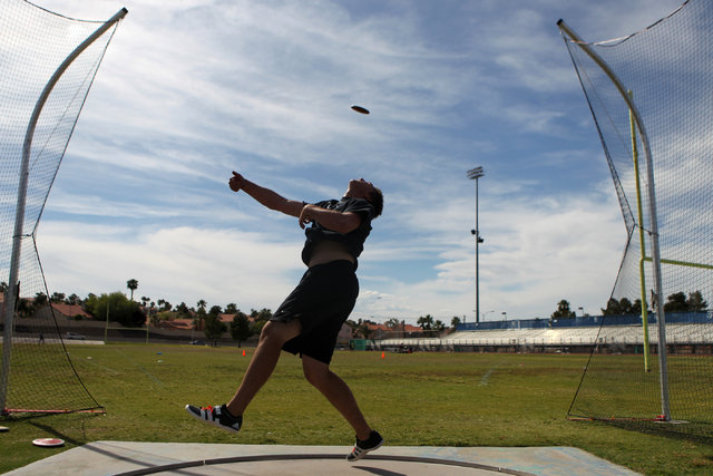 Brady Williams, 18, throws a discus during a practice at Green Valley High School in Henders ...