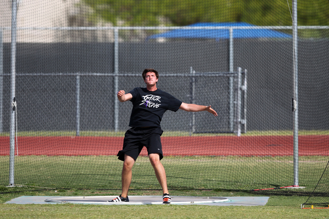 Brady Williams, 18, looks at his discus throw during a practice at Green Valley High School ...