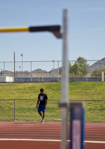 Basic High School high jumper Frank Harris prepares to demonstrate his form at the high jump ...