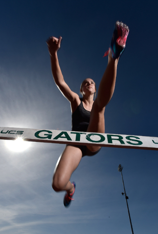 Sprinter Charleen Jordan clears a hurdle during track practice at Green Valley High School T ...