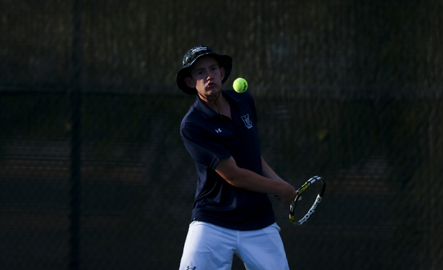 Nate van der Post of The Meadows School competes against Virgin Valley’s Chris Cannon ...