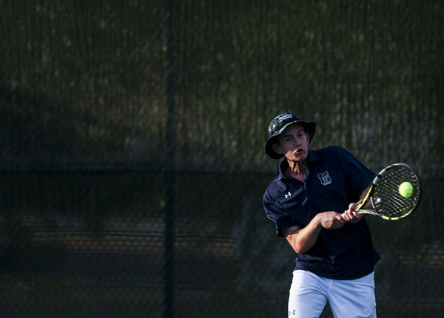 Nate van der Post of The Meadows School competes against Virgin Valley’s Chris Cannon ...