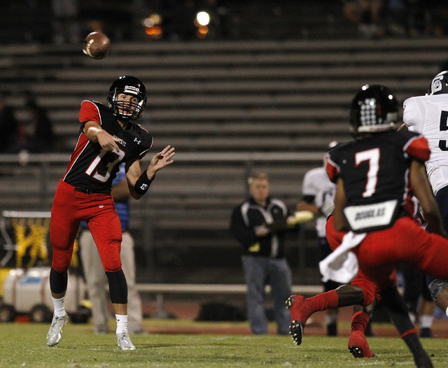 Las Vegas quarterback Trevor Swenson throws the ball against Centennial on Saturday. (Justin ...