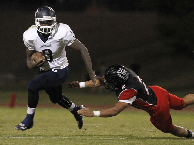 Centennial running back Rhamondre Stevenson eludes Las Vegas defender Jacob Littlefield on S ...