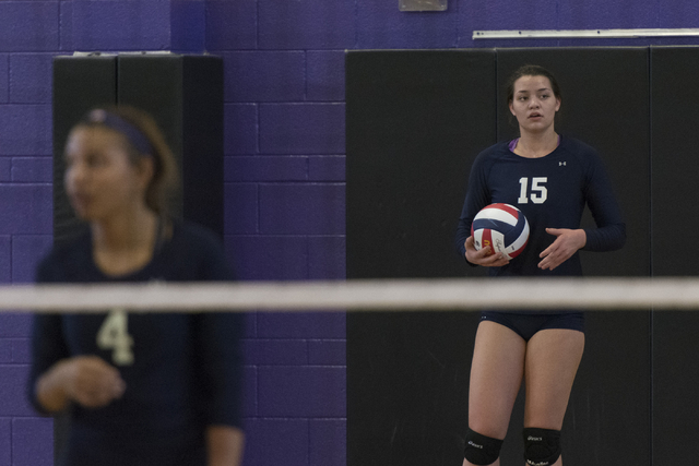 Shadow Ridge’s Whittnee Nihipali (15), right, prepares to serve the ball against Duran ...