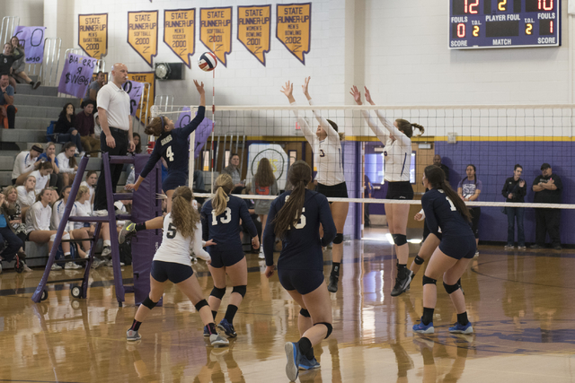 Shadow Ridge’s Kizzy Rodriguez (4), left, hits the ball against Durango during a Sunse ...