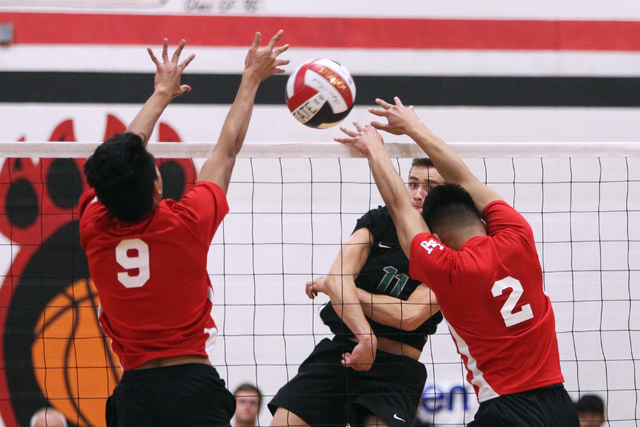 Palo Verde’s Michael Simister nails a shot between Las Vegas’ Ronell Sueno, left ...