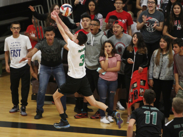 Palo Verde’s Jonathan Hecker chases an errant ball near Las Vegas fans during their Di ...