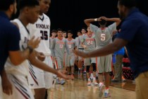 Bishop Gorman’s Chuck O’Bannon (5) reacts as a Findlay Prep’s coach slaps ...