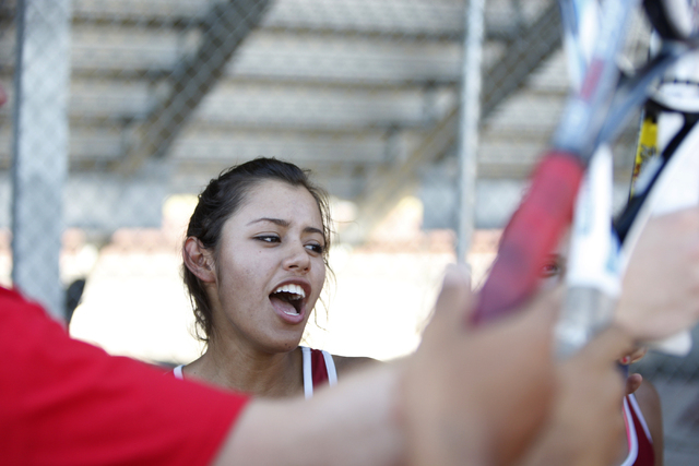 Western’s senior Nathalia Luna, 18, huddles with her team prior to her match against D ...