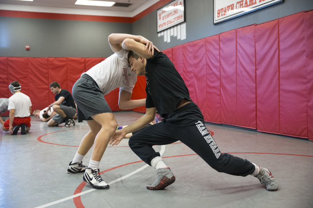 Ryder Marchello, left, 17, wrestles Matthew Alejandro, 18, during a wrestling practice at Ar ...